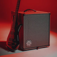 Angled front view of Darkglass Microtubes 500 Combo 112 Bass Amplifier with bass leaning on it in studio