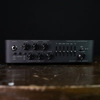 Front view of Darkglass Microtubes 900v2 Bass Amplifier Head on top of wood surface