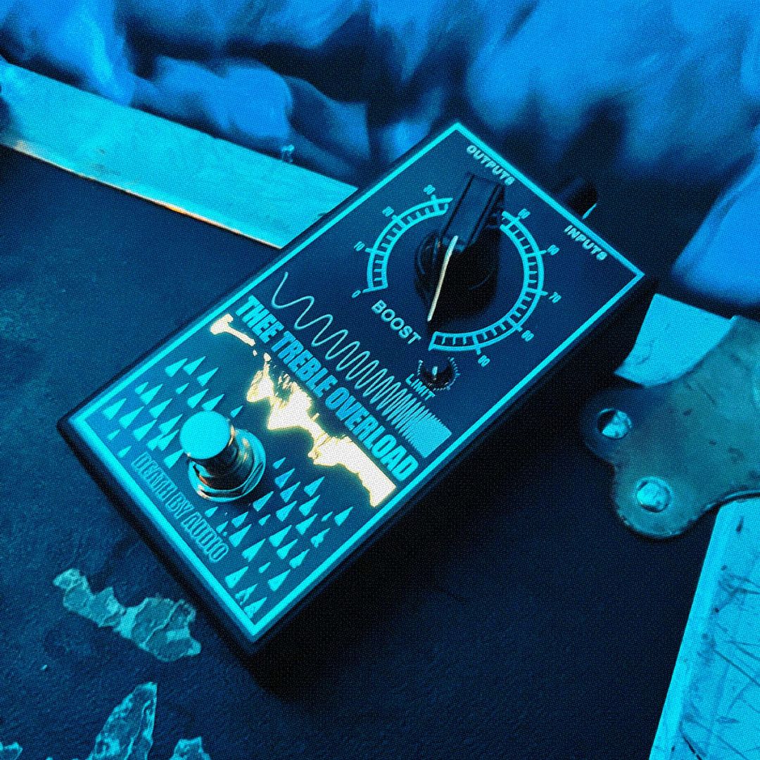 Angled front view of Death By Audio Thee Treble Overload Pedal on top of roadcase