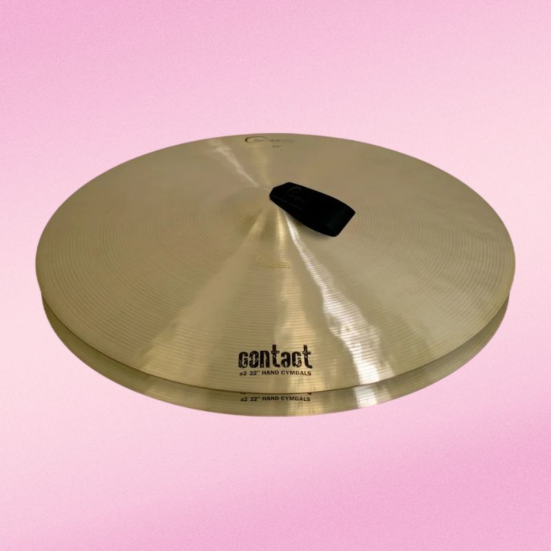 Front view of Dream Cymbals A2C22 Contact Series 22" Hand Cymbals (Pair) on pink background