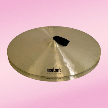 Front view of Dream Cymbals A2C22 Contact Series 22" Hand Cymbals (Pair) on pink background