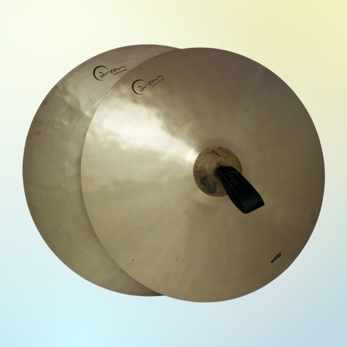 Front view of Dream Cymbals A2E21 Energy Series 21" Hand Cymbals (Pair) on yellow and blue gradient background