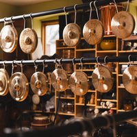Various Dream Cymbals Mbao Nipple Gongs hanging in studio