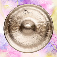 Front view of Dream Cymbals Tuned Mbao Nipple Gong on multicolored background