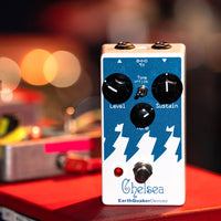 EarthQuaker Devices Chelsea Pedal On a Red Surface