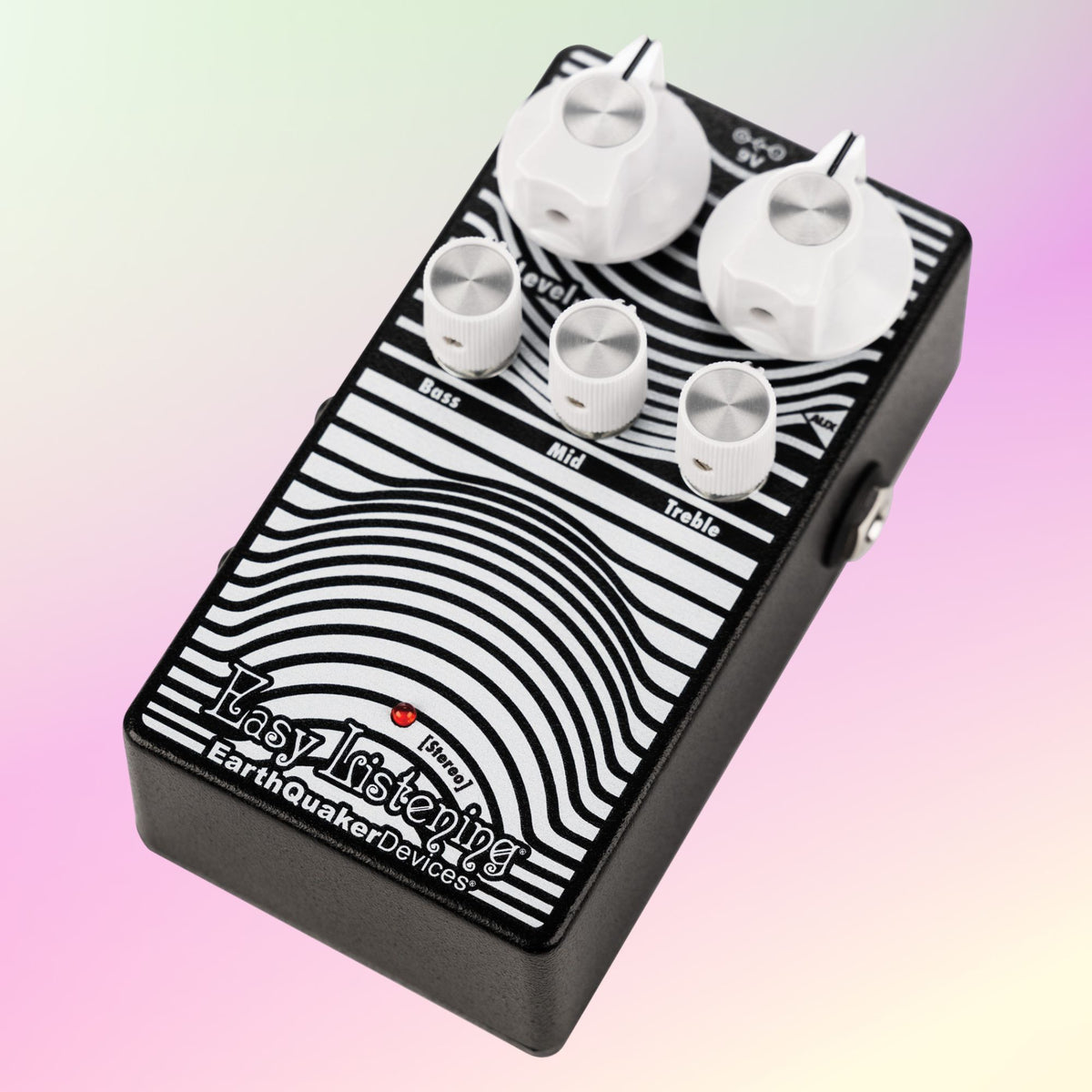 Angled front view of EarthQuaker Devices Easy Listening Stereo Pedal on pink background