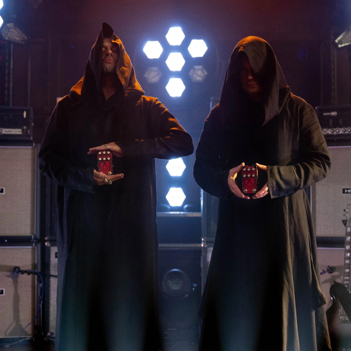 Sunn O))) members each holding the EarthQuaker Devices Sunn O))) HalfLife Pedal on stage