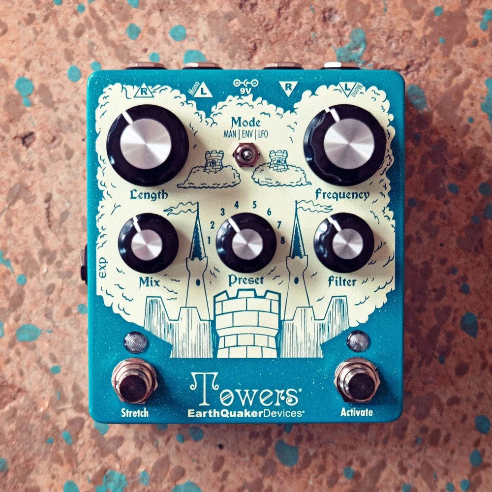 Front view of EarthQuaker Devices Towers Stereo Reverb Pedal on brown with teal accents surface