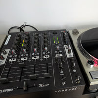 Angled front view of Ecler NUO4.0F Professional 4-Channel DJ Mixer Black attached to turntable
