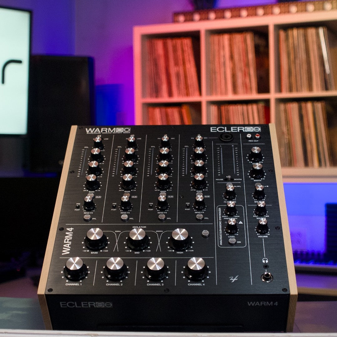 Tilted front view of Ecler WARM4 Professional 4-Channel Analog Rotary DJ Mixer in studio