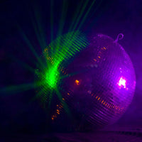 Eliminator Lighting 16" Disco Mirror Ball shining green and pink lights in dim studio