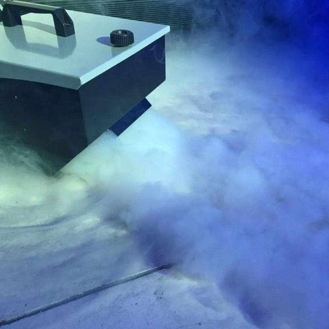 Eliminator Lighting Mister Kool EP Fog Machine releasing fog in dark venue