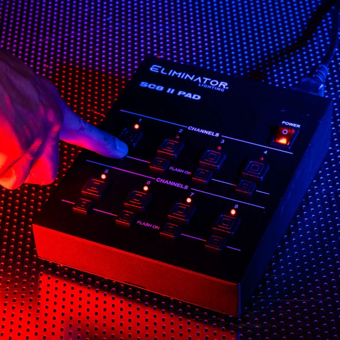 Angled view of Eliminator Lighting SC8 II Pad with finger tapping it on metal surface