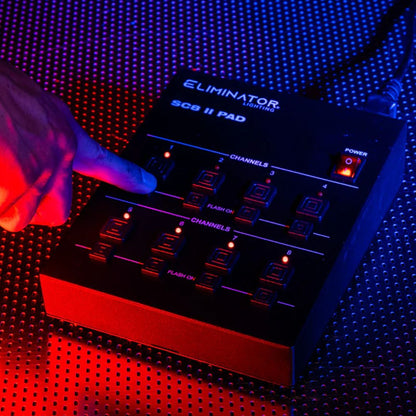 Angled view of Eliminator Lighting SC8 II Pad with finger tapping it on metal surface