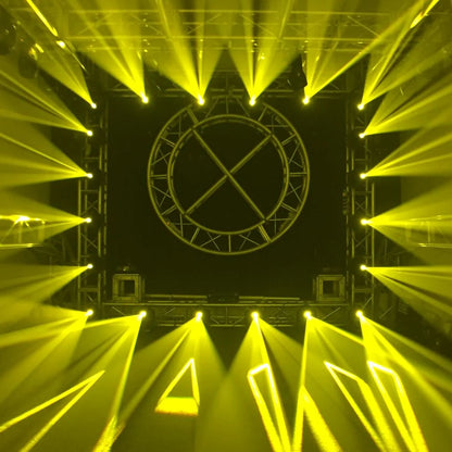 Multiple hanging Eliminator Lighting Stealth Spot LED Moving Light Heads beaming yellow triangles in dim venue