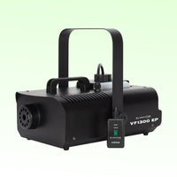 Angled view of Eliminator Lighting VF1300 EP Wireless Fog Machine with remote on green background