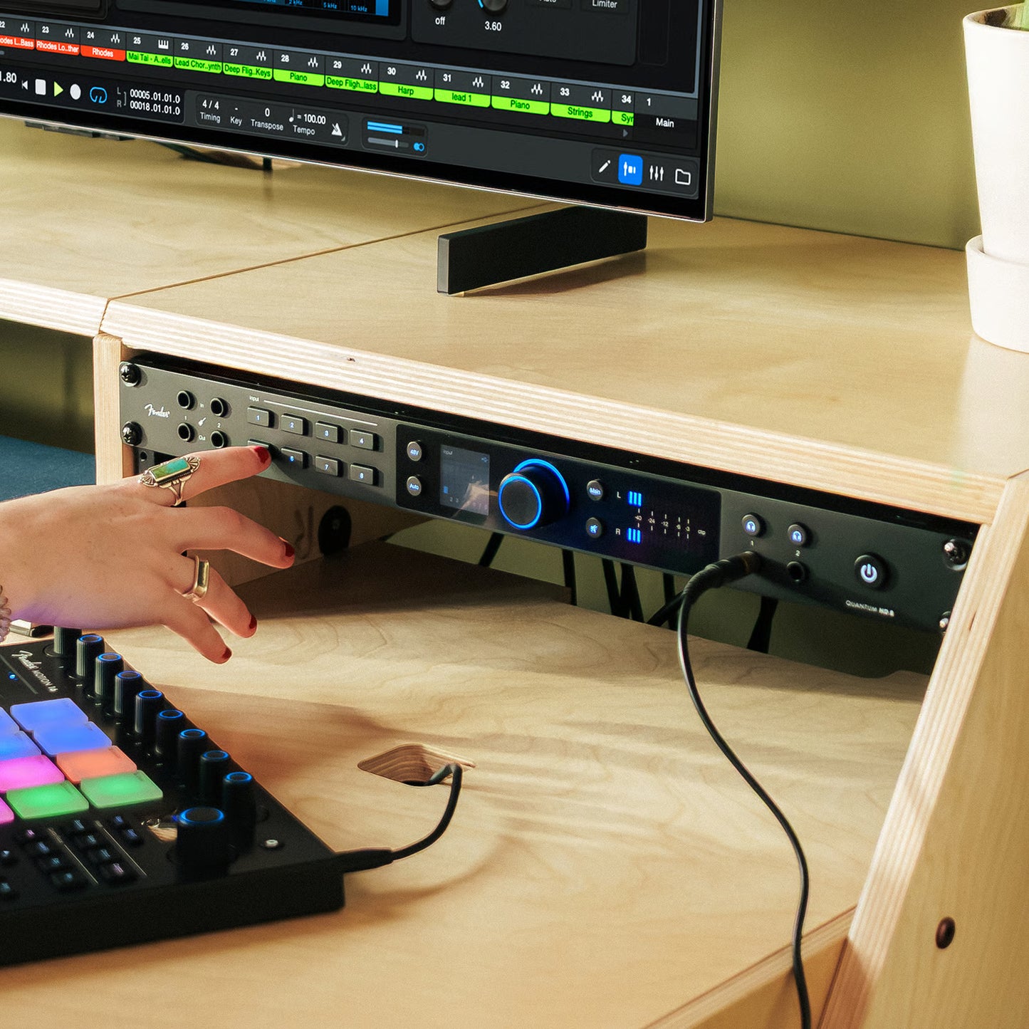 Fender Quantum HD 8 USB-C Audio Interface mounted on desk in studio