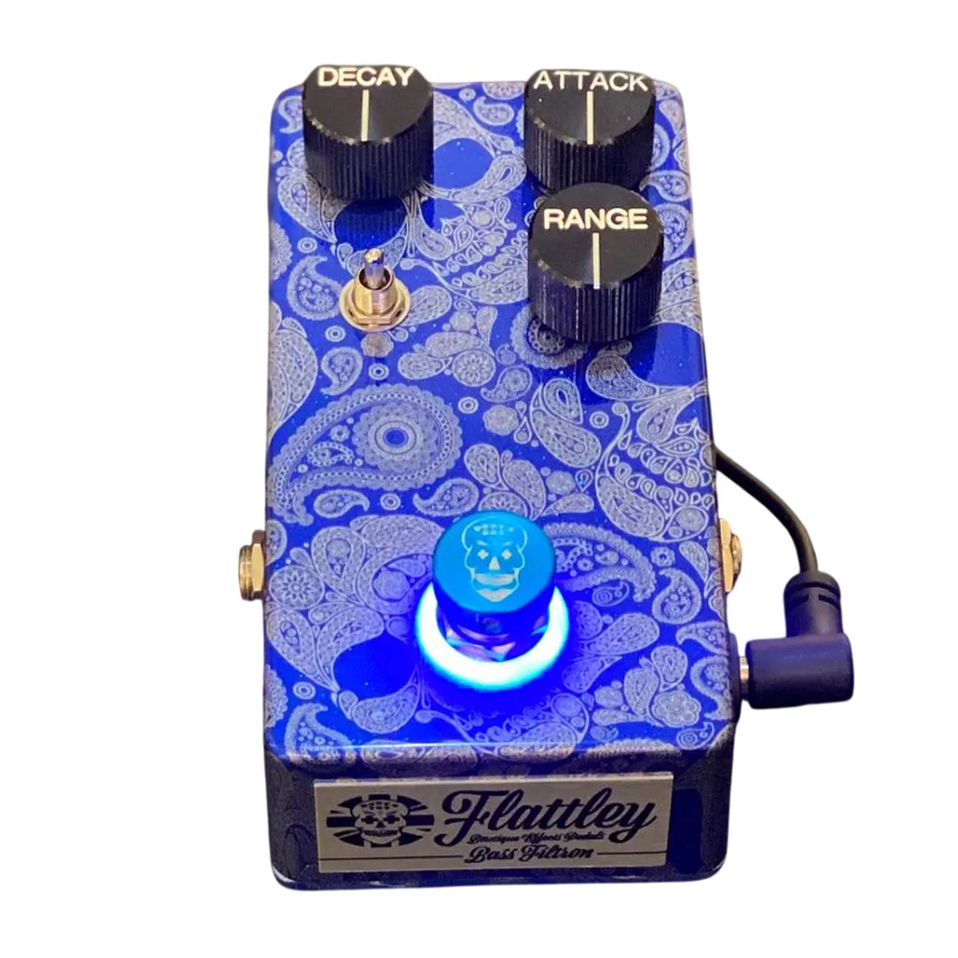 Angled front view of Flattley Bass Filtron Bass Envelope Filter Pedal with power cable attached on white background