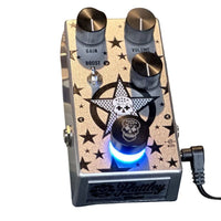 Top view of Flattley Plexstar Plexi Drive Pedal with power cable attached on white background