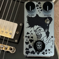 Top view of Flattley Poison Ivy Octave Harmonic Fuzz Pedal on top of guitar