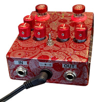 Top jacks view of Flattley The Outlaw Pedal with power supply cable attached on white background