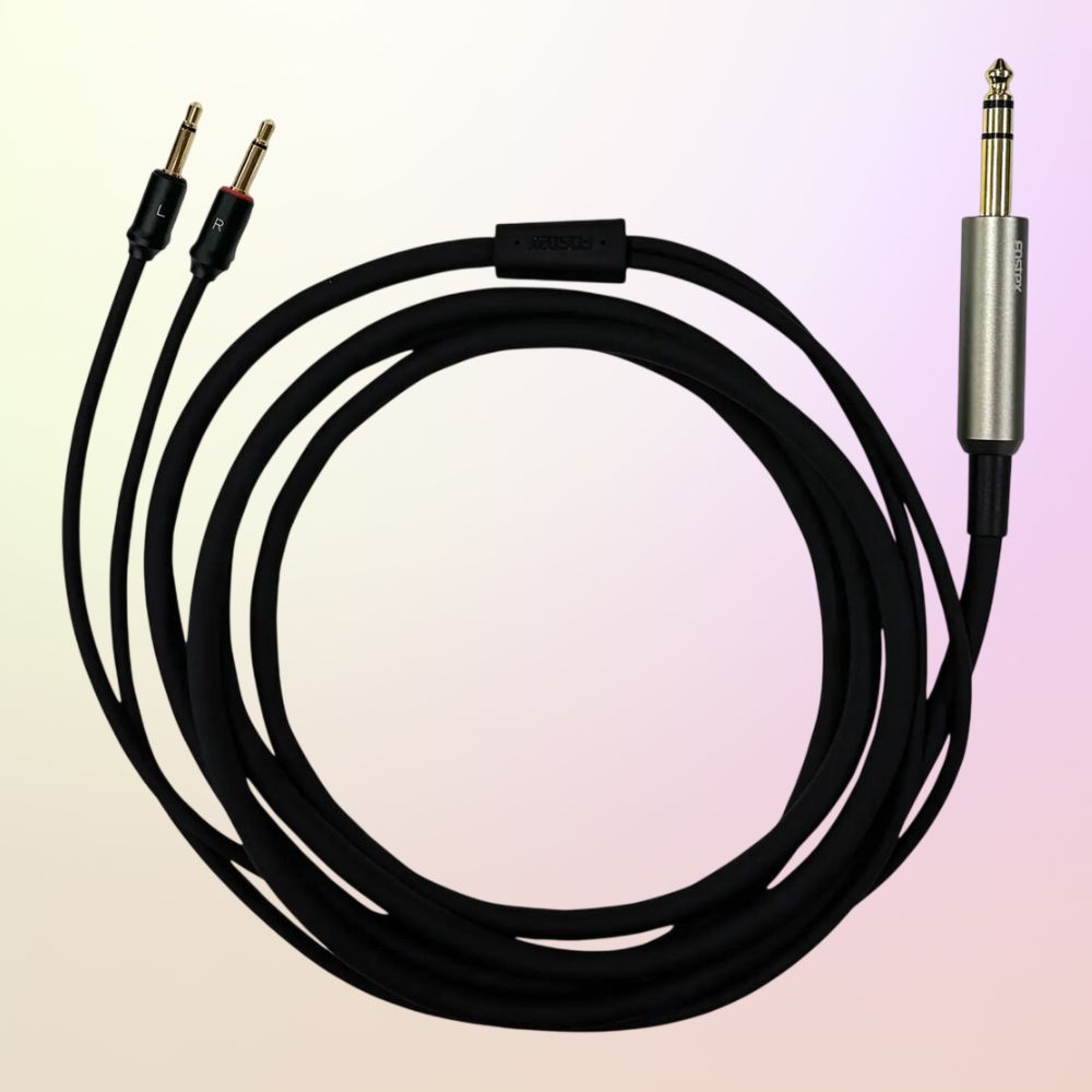 Coiled Fostex ET-TH2.0UB2Y Unbalanced Cable on pink and yellow gradient background