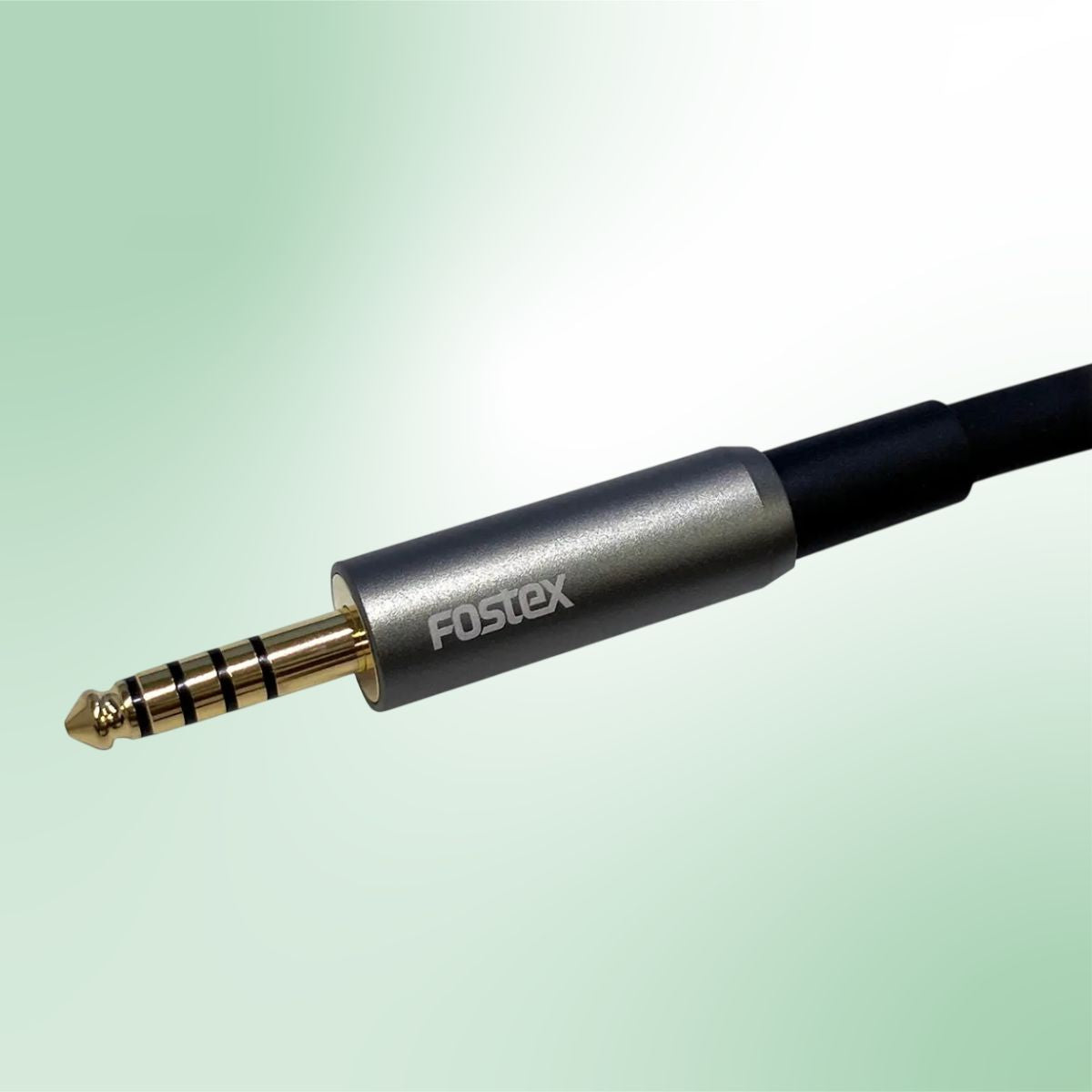 Close up plug view of Fostex ET-TH4.4BL 4.4mm 5-Pole Balanced Cable on green background