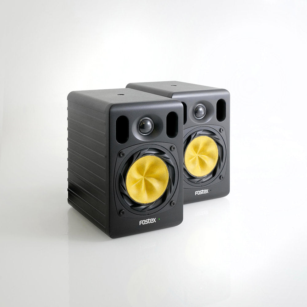Angled view of Fostex NF04R 4" Active Speaker Pair on grey background