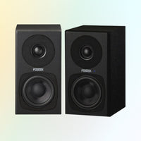 Front view of Fostex PM0.3H-B 3" 2-Way 30W Active Speaker on gradient yellow and blue background