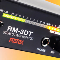Close up view of Fostex RM-3DT Stereo Rack Monitor on orange background