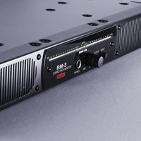 Close up angled view of Fostex RM-3 Stereo Rack Monitor on grey surface