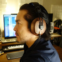 Studio engineer wearing the Fostex T60RPmk2 RP Semi-Open Stereo Headphones in studio