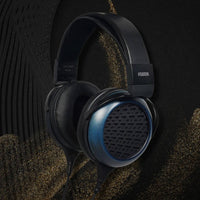 Angled view of Fostex TH1100RPmk2 Premium Headphones on black background with gold accents