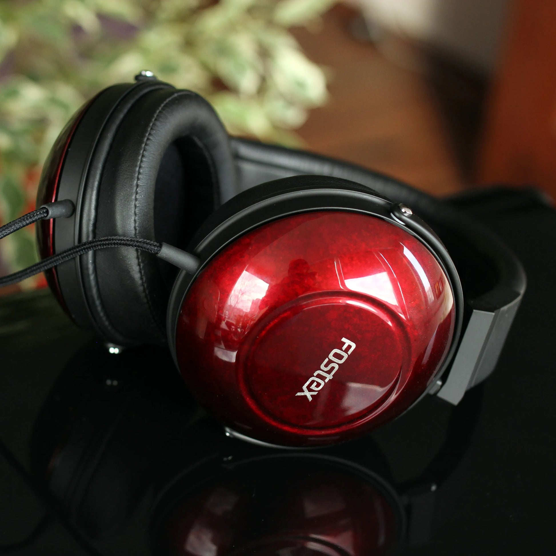 Fostex TH900mk2LE Premium Headphones on top of black surface in studio