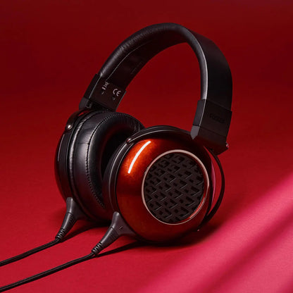 Angled view of Fostex TH909LE Premium Headphones on red background
