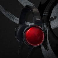 Angled view of Fostex TH910 Premium Headphones on black background with white accents
