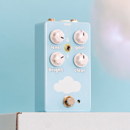 Angled front view of FruitFX CloudDriver Pedal on top of white box with blue background