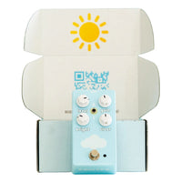 Front view of FruitFX CloudDriver Pedal leaning on opened FruitFX box on white background