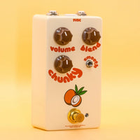 Angled view of FruitFX Coconut Compressor Pedal on yellow background