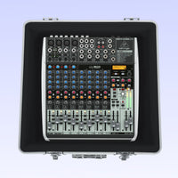 Sound mixing console with Behringer logo in a carrying case on a light blue background