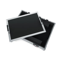 Stack of black electronic panels with metal frames on a white background