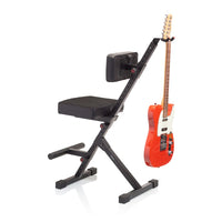 Guitar stand with an orange electric guitar on a white background