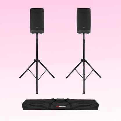 Two black speakers on stands with a carrying bag on a pink background