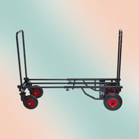 Black hand truck with red wheels on a gradient background