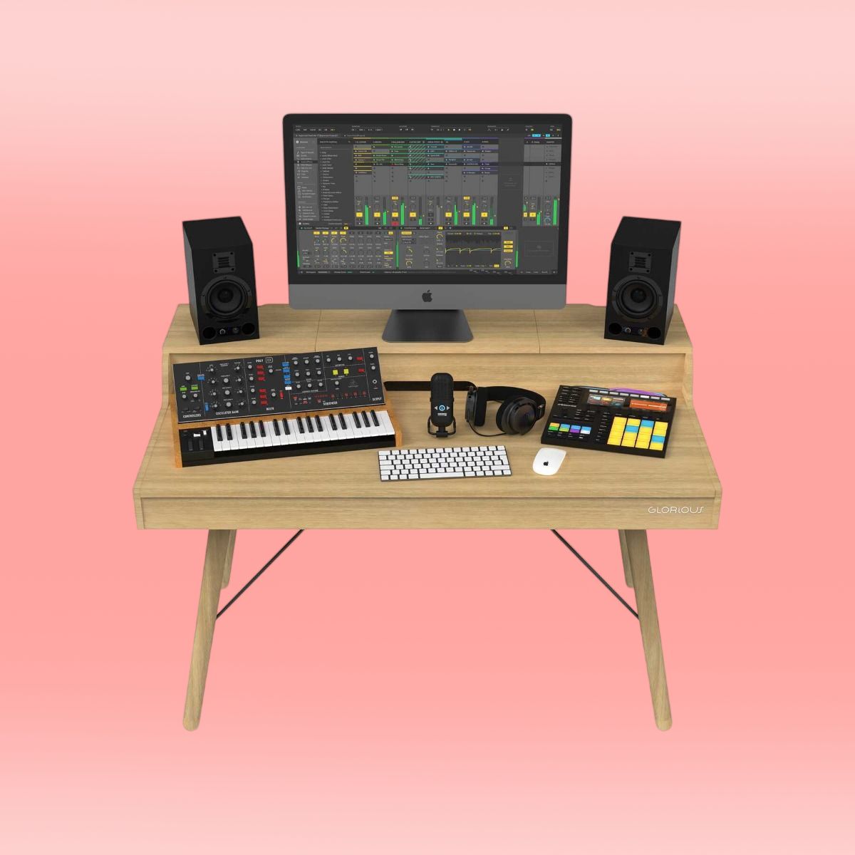 Front view of Glorious Vintage Music Station with gear on it on pink background