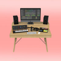 Front view of Glorious Vintage Music Station with gear on it on pink background