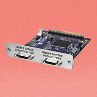 Angled front view of Grace Design 32-Channel DigiLink I/O for m701 on pink background