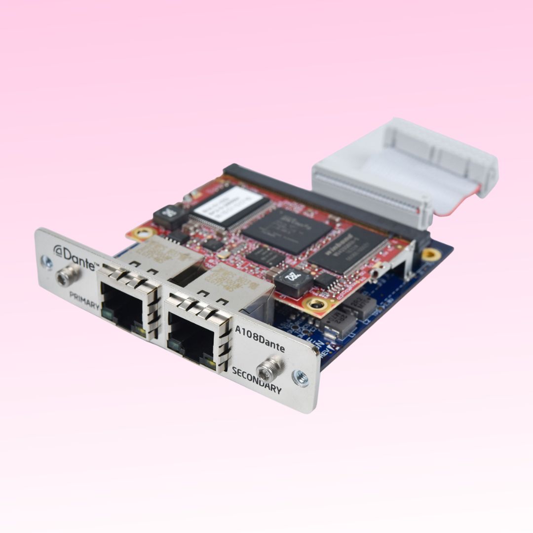 Angled view of Grace Design Dante Option Module for m108 on pink background
