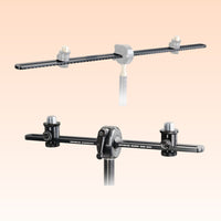 Angled front view of the Grace Design SB-30/66 Spacebar Stereo Microphone Mounting Kit on orange background