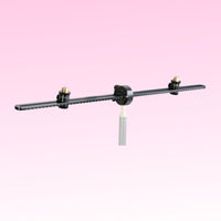 Angled front view of Grace Design SB-66 25.98" Spacebar Stereo Microphone Mounting Kit on pink background